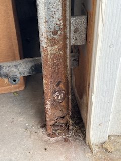 Rusty Rail rotated Rusted Garage Door Guide Rails